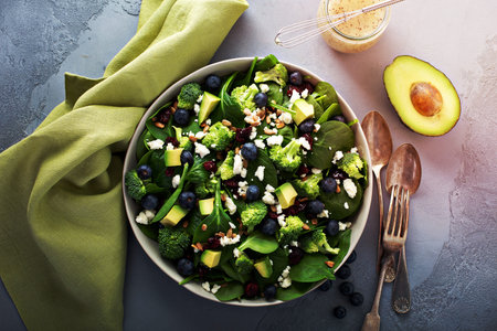 Fresh spinach and feta salad with blueberries, and broccoliの写真素材