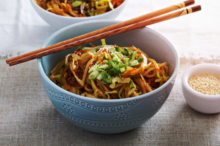 Stir fry with rice noodles, cabbage and carrotの写真素材