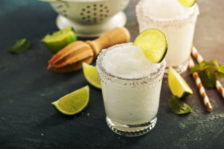 Frozen lime and mint margarita in glassesの写真素材