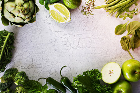 Variety of green vegetables and fruits copyspace on whiteの写真素材