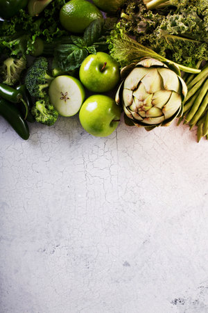 Variety of green vegetables and fruits copyspace on whiteの写真素材