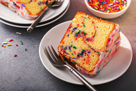 Celebration funfetti pound bundt cake with sprinkles and sugar glazeの写真素材