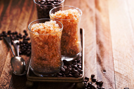 Coffee granita in small glasses with caramel syrupの写真素材