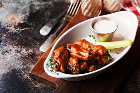 Hot wings appetizer plate with barbecue sauceの写真素材