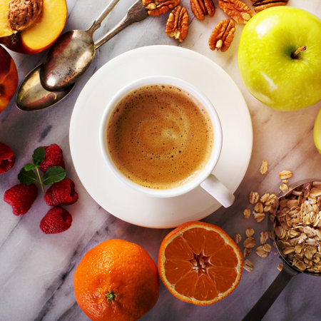 Healthy breakfast ingredients with oats, fruits and berries overhead shot on marble backgroundの写真素材
