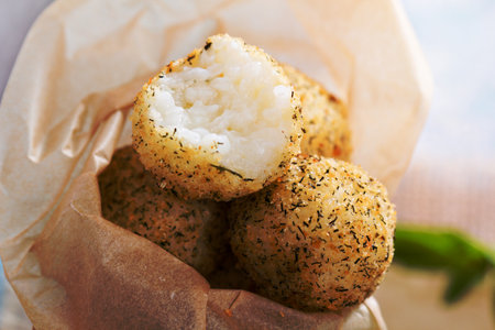 Vegan risotto arancini fried with herbs and breadcrumbsの写真素材