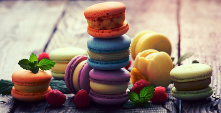 baked macarons on a wooden table, gourmet almond flour dessert, close upの写真素材