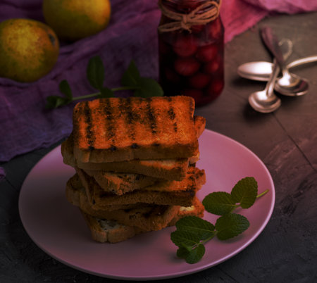 fried French toast on a ceramic pink plate, top viewの写真素材
