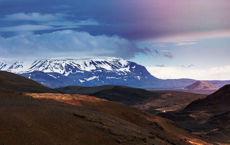 Scenic landscape of snow covered mountains at Myvatn area in Iceland with cloud coverの写真素材