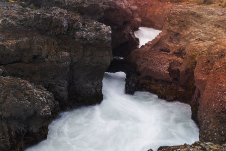Rock formations and erosion at Barnafossar water falls in rural Icelandの写真素材