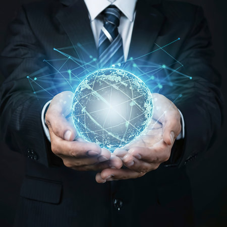 Businessman holding global customer network connection in handsの素材