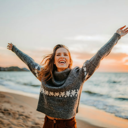 Happy woman celebrating the new year at the beachの素材