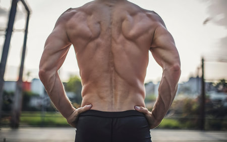 The back and buttocks of young athletic guyの素材