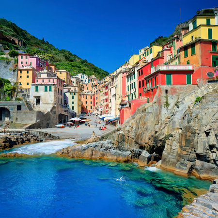 peaceful fishing village riomaggiore cliffside colorful buildings cinque terre coast italian rivera mediterranean europeの素材