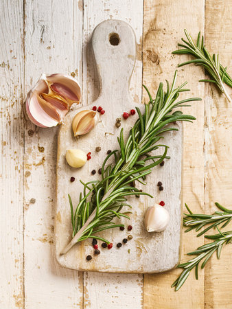 Rosemary, Pepper and Garlic on a wooden backgroundの素材