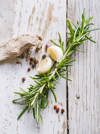 Rosemary, Pepper and Garlic on a wooden backgroundの素材