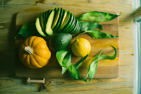 Avocado pumpkin green lemon on wood backgroundの素材