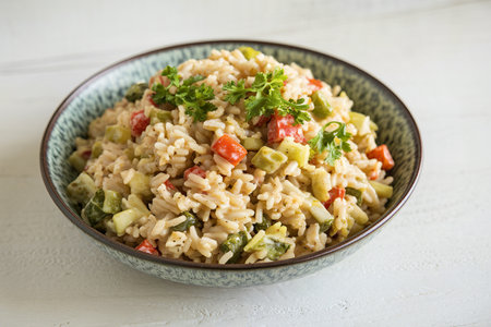 A photo of a bowl filled with a creamy rice dishの写真素材