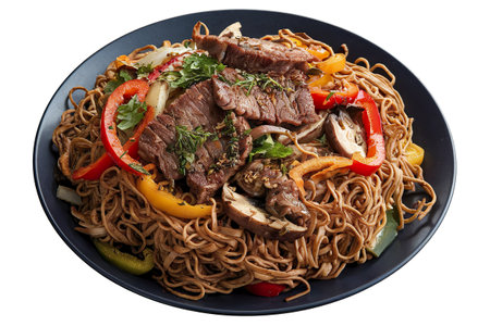 A photo of a plate with homemade noodles fried with meat, vegetables, and herbsの写真素材