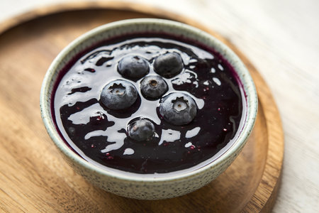 A photo of blueberry jam in a bowlの写真素材