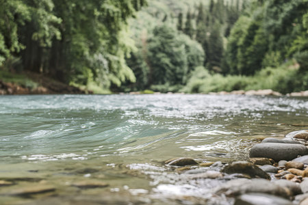A close-up photo of the wavy water surface of a small riverの写真素材