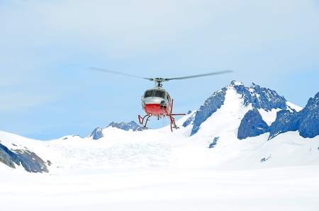 Helicopter taking off in the snowの写真素材