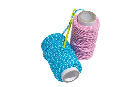 Threads with needle on white isolated backgroundの写真素材