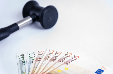 Judge gavel and stack of euro money white backgroundの写真素材