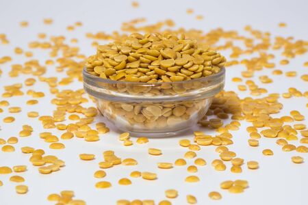 Split and skinless black gram or lentils in a glass bowl, also known as urad dal in Indiaの写真素材