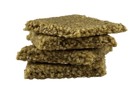 Sesame bars also known as til chikki in India used as Indian sweet dish on festival, stacked with white backgroundの写真素材