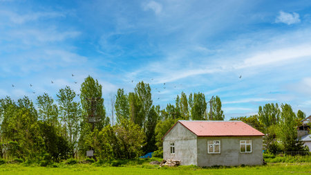 Green landscape and new house, blue sky. Sample image for village tourismの写真素材