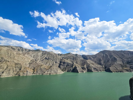Scenic view of Tortum Lake with surrounding mountains, a landslide dam lake in Erzurum, Turkey.の写真素材