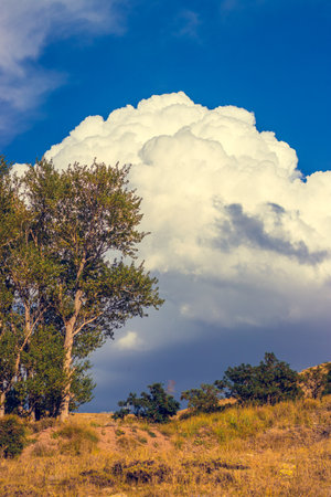 Clouds over the countryside, perfect wallpaper background.の写真素材
