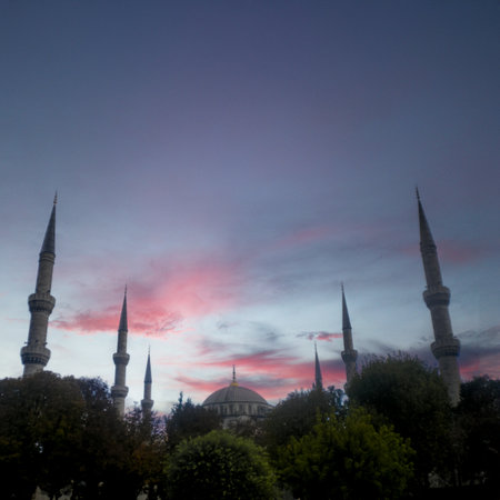 Istanbul mosque at sunset with pink clouds, capturing Ramadan ambiance.の写真素材