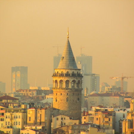 Golden hour over Galata Tower, blending Istanbul's historic charm and dynamic urban growth,...