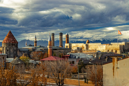The historic skyline of Erzurum with its iconic castle, Twin Minaret Madrasa, mosques, and tombs,...