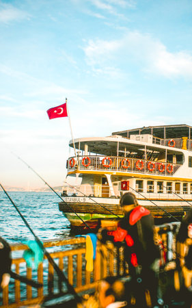 Nostalgic Istanbul: Ferry, fishermen, and the Bosphorus breezeの写真素材