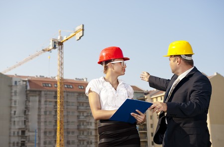 Group of Professional  Engineers discussing on site の写真素材