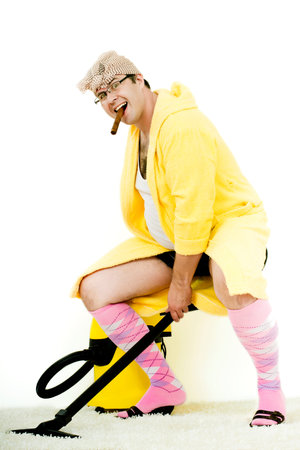 crazy carpet cleaner vacuuming with vacuum cleaner in the yellow robeの写真素材