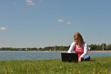 woman with laptop in natureの写真素材