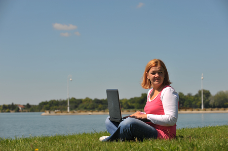 woman with laptop in natureの写真素材
