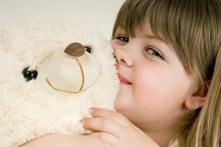 a girl and her beloved bearの写真素材