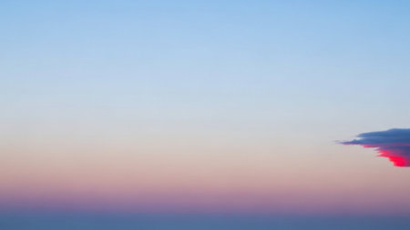 Sunset sky background with tiny clouds in pastel colors. Abstract nature background.の素材