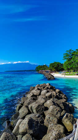 Very beautiful beach with rocks and blue skyviewの写真素材