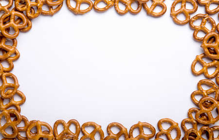 Background of homemade mini pretzels on an isolated background with copy spaceの写真素材