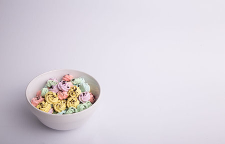Homemade meringue in a bowl on an isolated background with copy space
