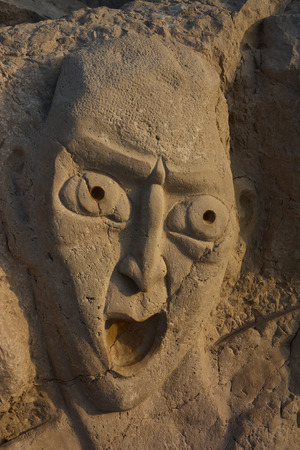 Face in stoneの写真素材