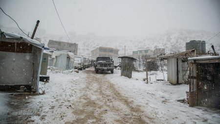 Snow Covering Syrian Refugees Camp in Arsal Village East Beqaa Lebanon at Syria Borders after Heavy Stormのeditorial素材