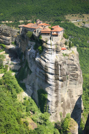 Beautiful meteora with old church on top of high mountainの写真素材