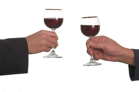 businessman clinking glassesの写真素材